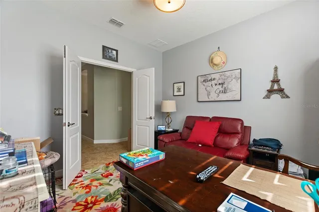 a view of a dining room with furniture and chandelier