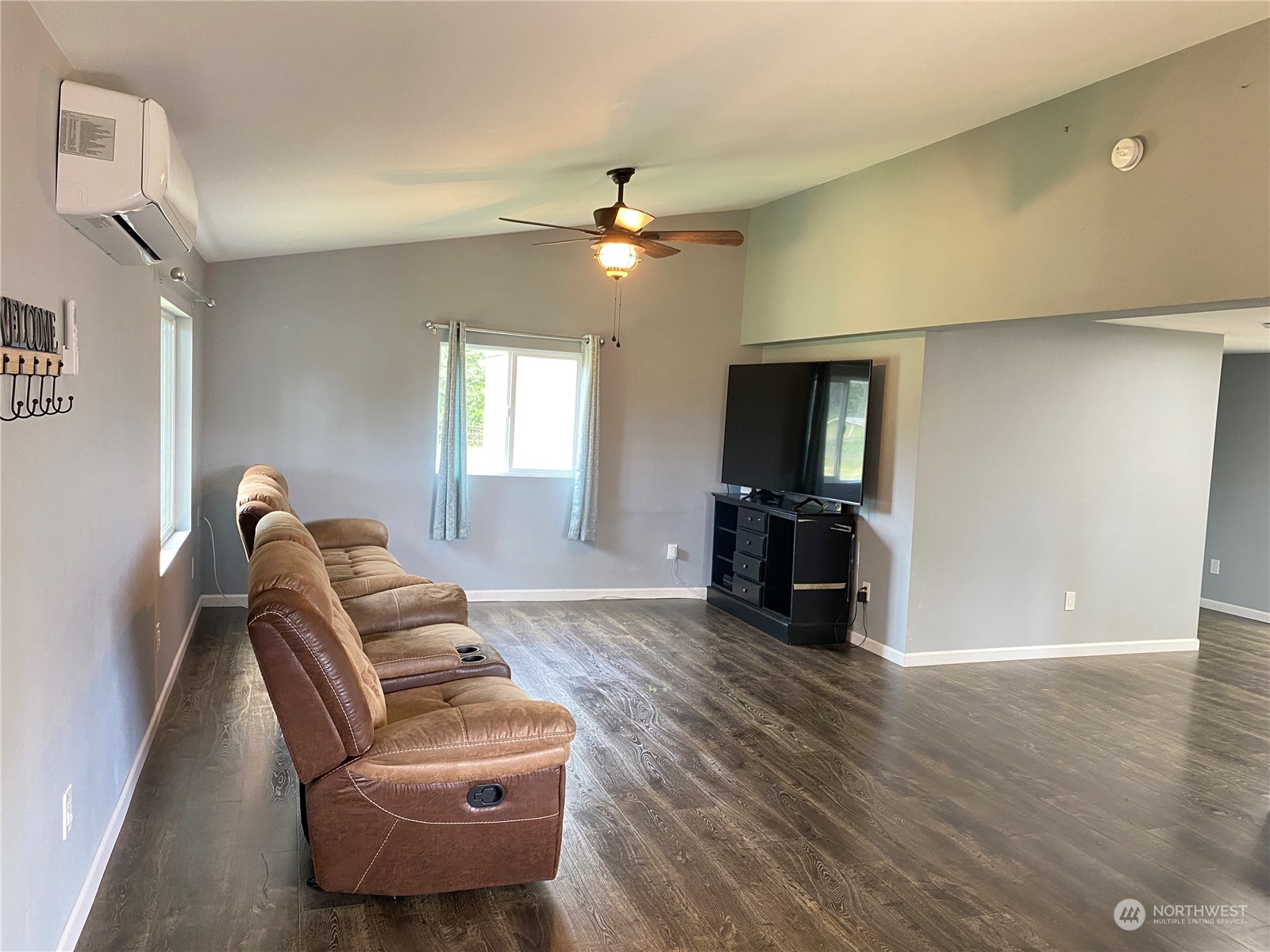 17540 Sargent Road Southwest Rochester, WA 98579 - Photo 4 of 27 a living room with furniture and a flat screen tv
