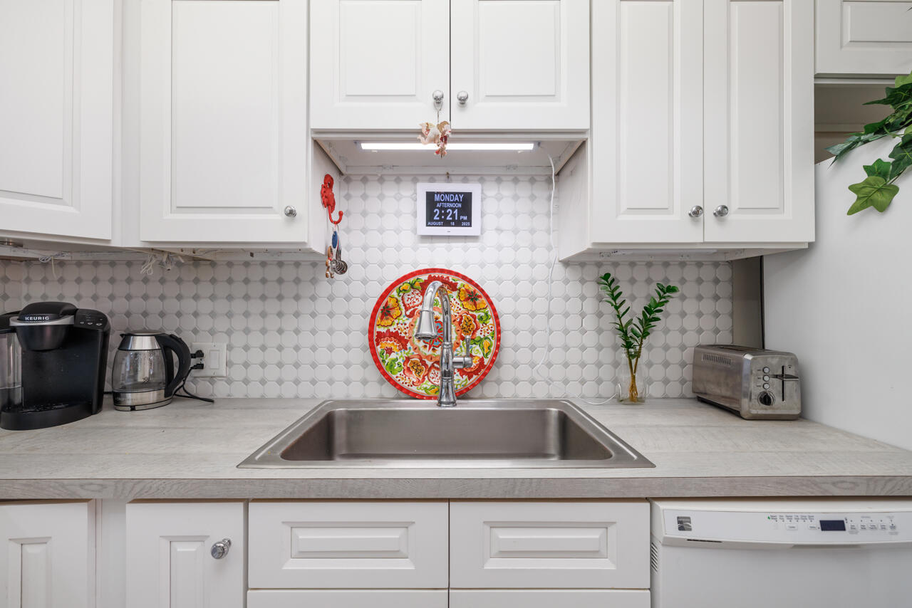 5996 Southeast Riverboat Drive, Unit 539 Stuart, FL 34997 - Photo 11 of 29 a kitchen with sink and cabinets