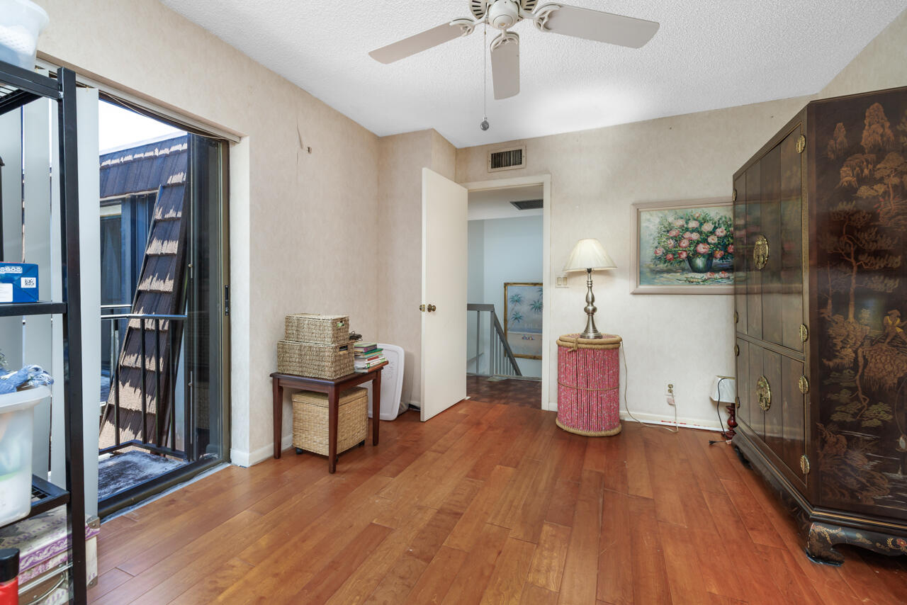 5996 Southeast Riverboat Drive, Unit 539 Stuart, FL 34997 - Photo 18 of 29 a view of a workspace with furniture and wooden floor