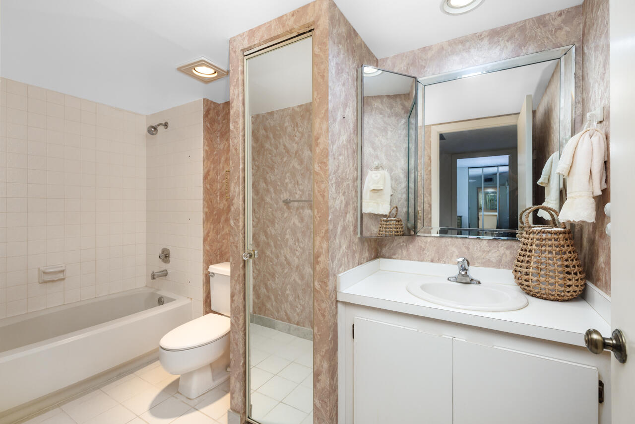 5996 Southeast Riverboat Drive, Unit 539 Stuart, FL 34997 - Photo 19 of 29 a bathroom with a sink a toilet and shower