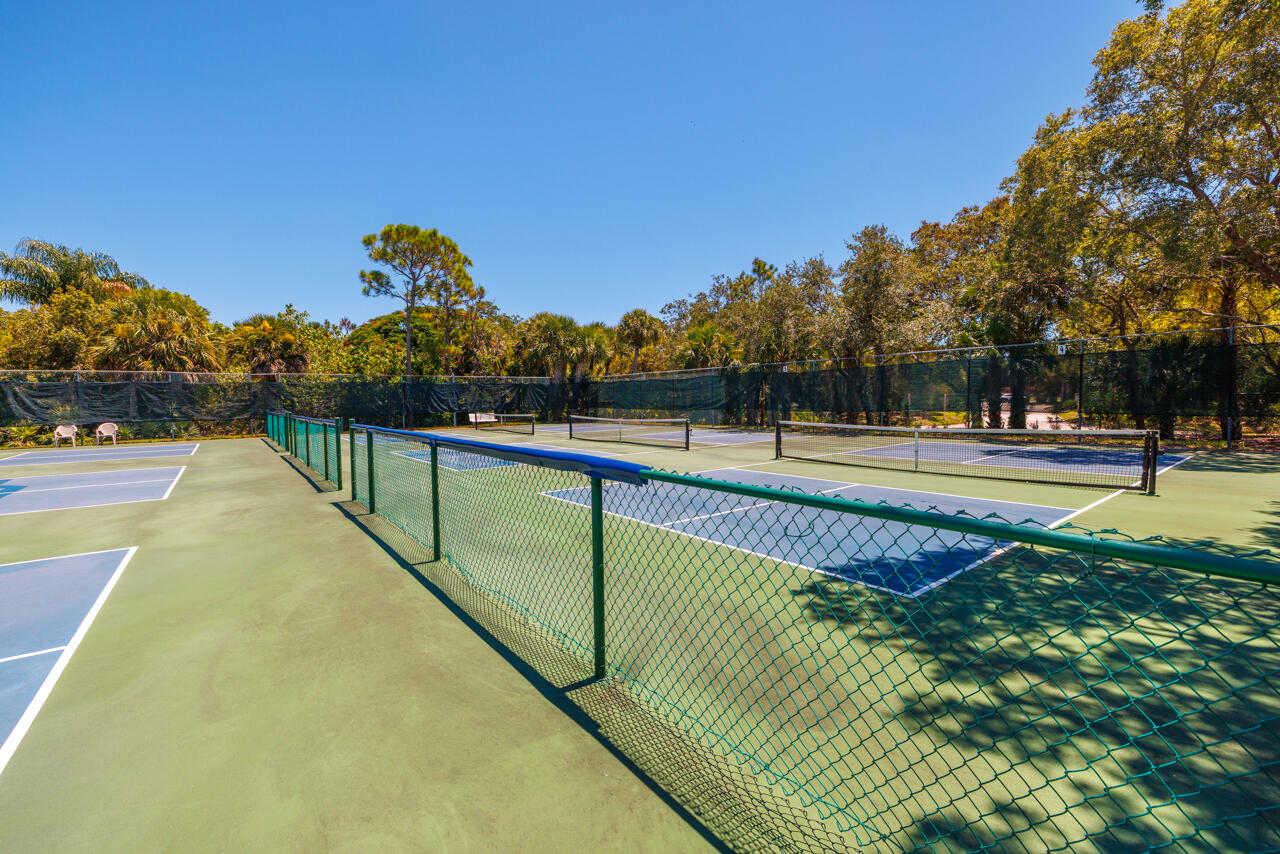 5996 Southeast Riverboat Drive, Unit 539 Stuart, FL 34997 - Photo 27 of 29 a view of a swimming pool with a patio