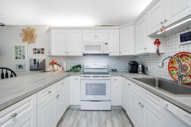 a kitchen with sink and cabinets