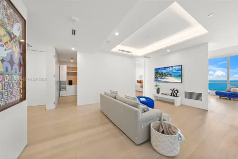 a bed sitting in a room next to a window