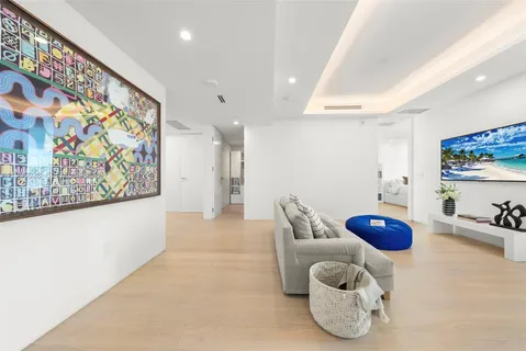 a spacious bedroom with a bed and a couch