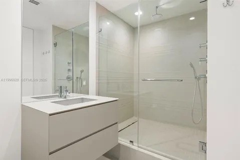 a utility room with sink dryer and washer