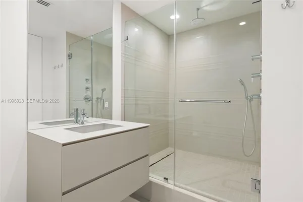 a utility room with sink dryer and washer
