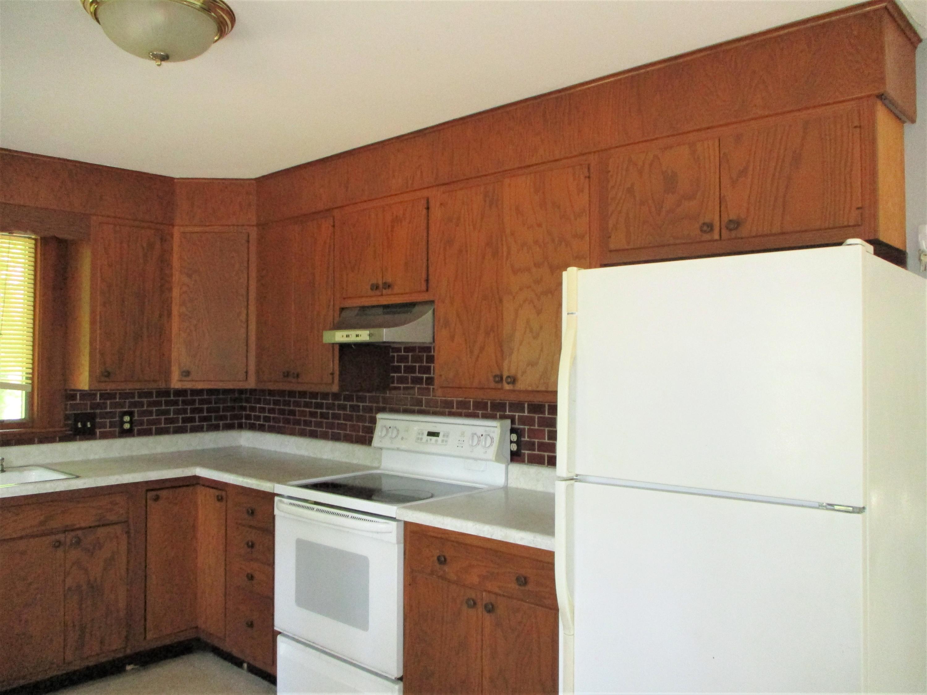 5 Day Road Wellfleet, MA 02667 - Photo 8 of 39 a kitchen with a sink a stove and a refrigerator