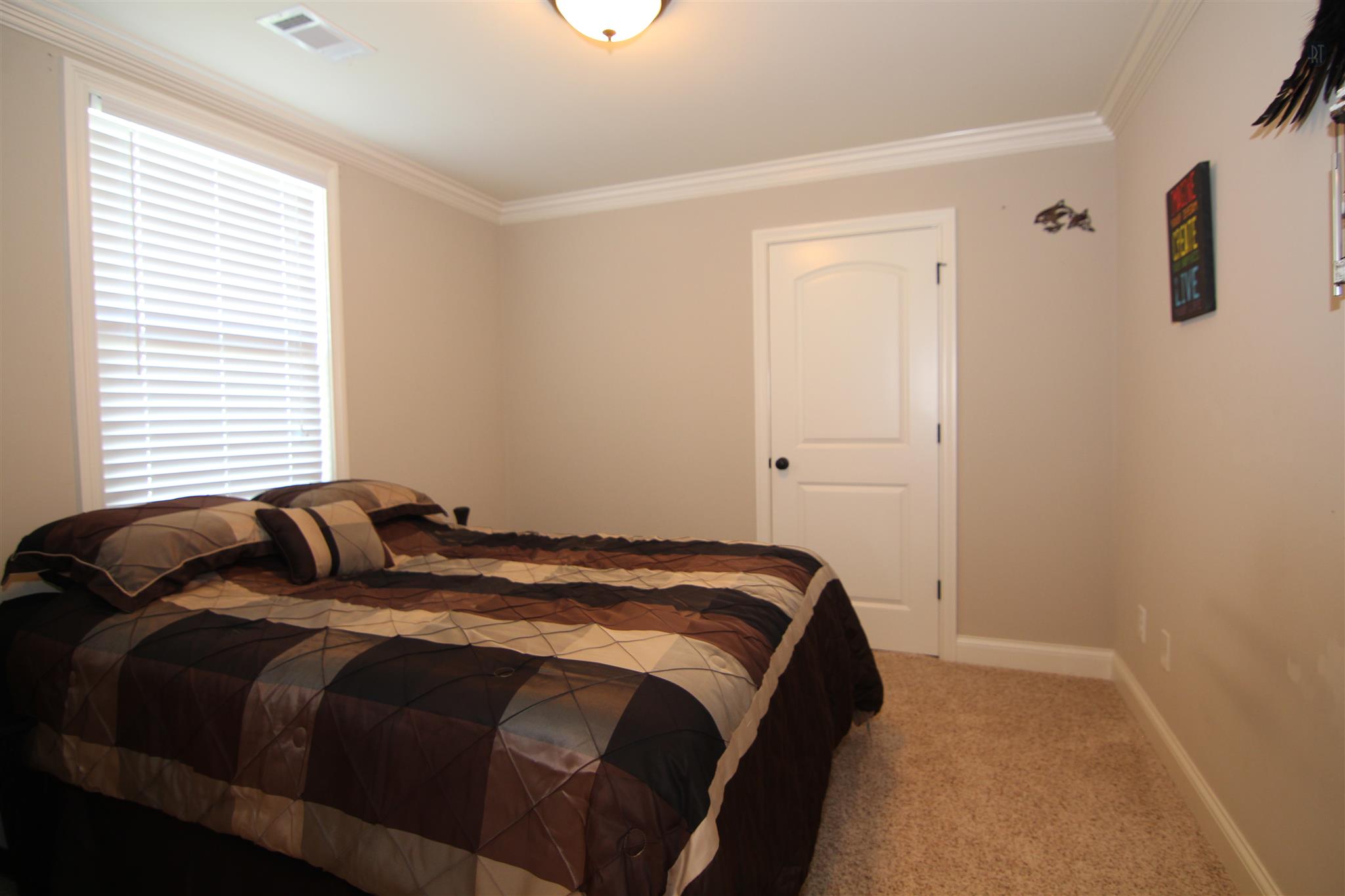 704 Academy Road Lebanon, TN 37087 - Photo 13 of 16 a bedroom with a bed and window