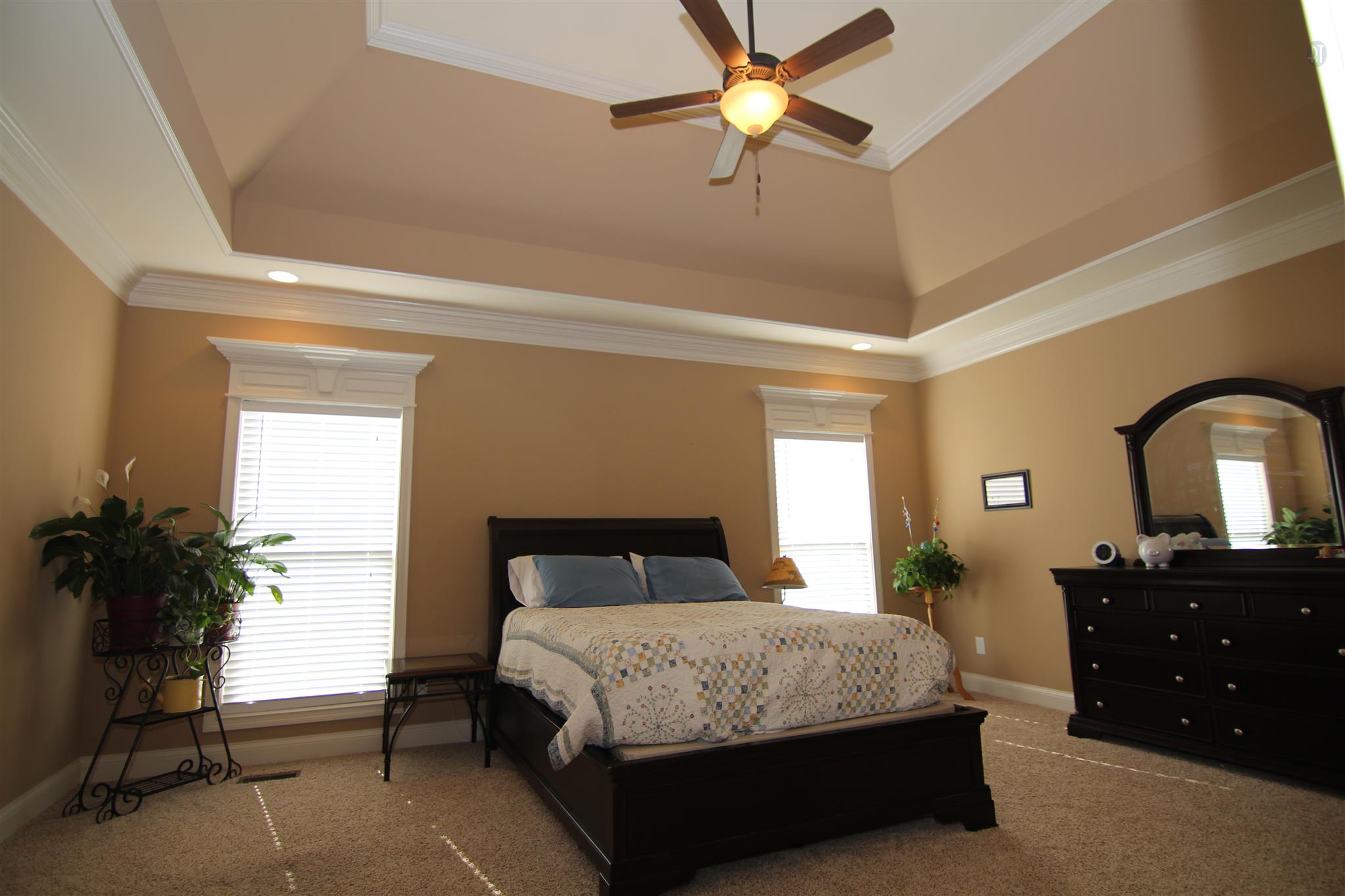 704 Academy Road Lebanon, TN 37087 - Photo 8 of 16 a bedroom with a bed and a chandelier