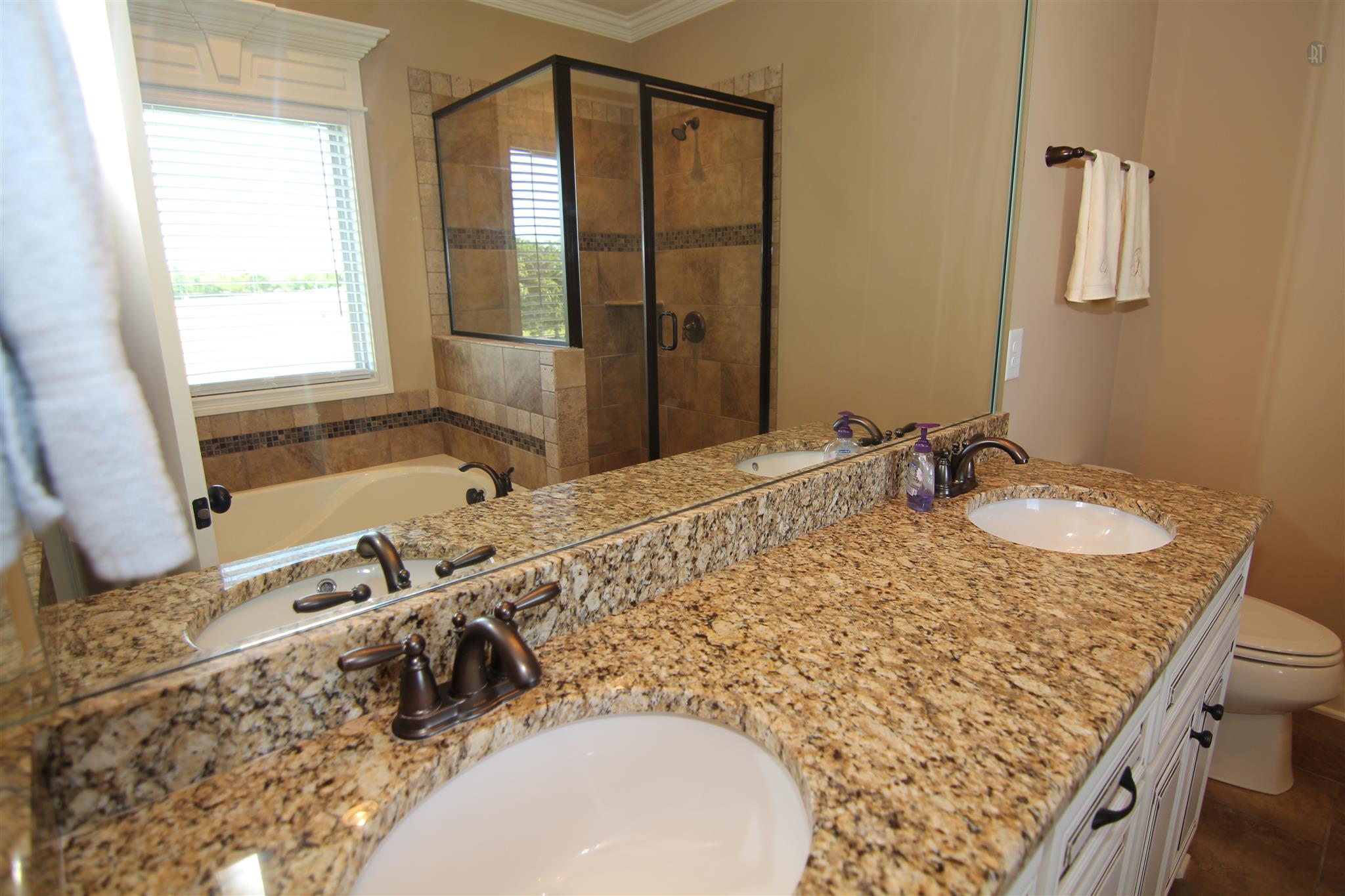 704 Academy Road Lebanon, TN 37087 - Photo 9 of 16 a bathroom with a granite countertop sink and a mirror