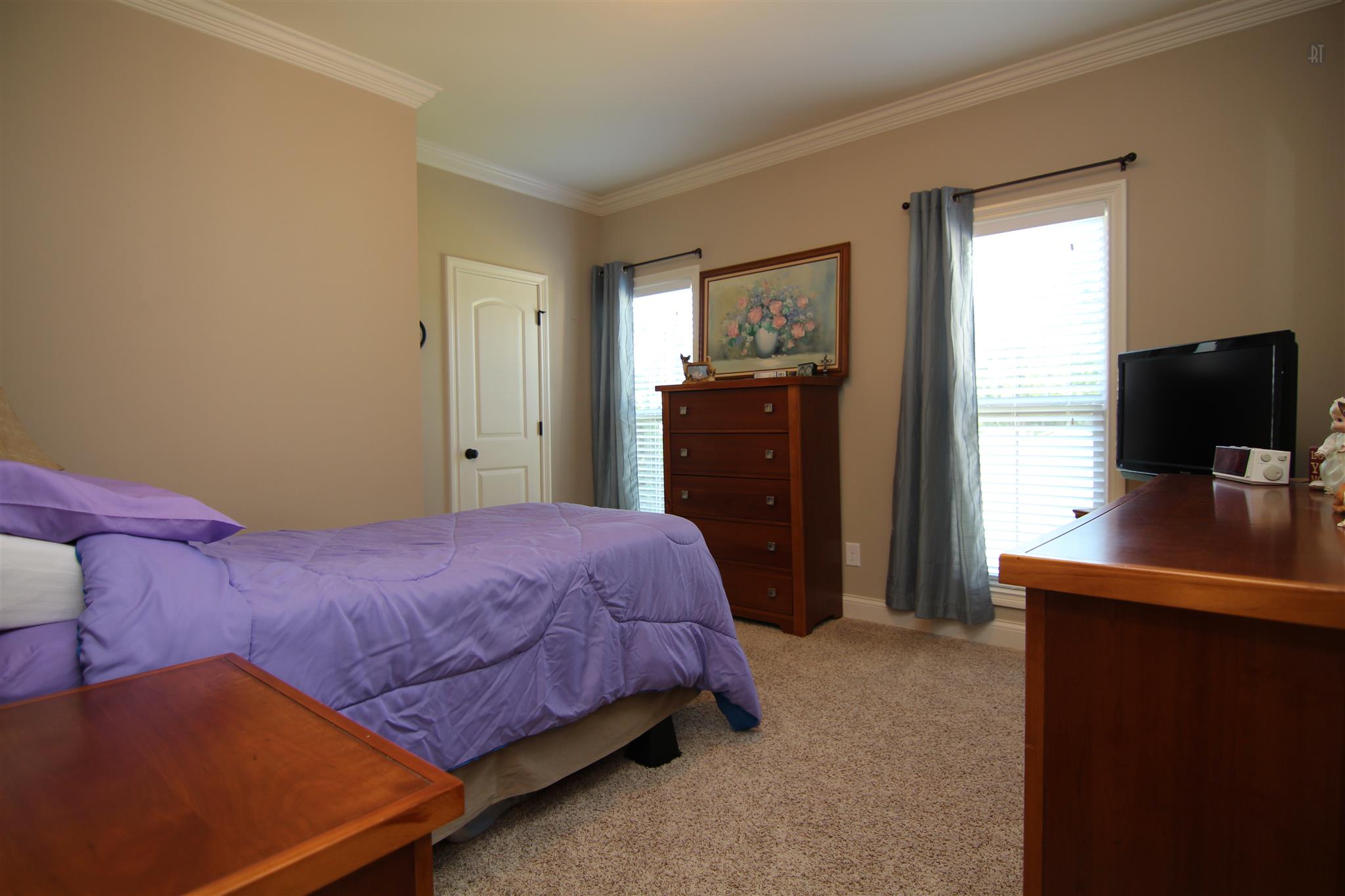704 Academy Road Lebanon, TN 37087 - Photo 10 of 16 a bedroom with a bed and a flat tv screen on dresser