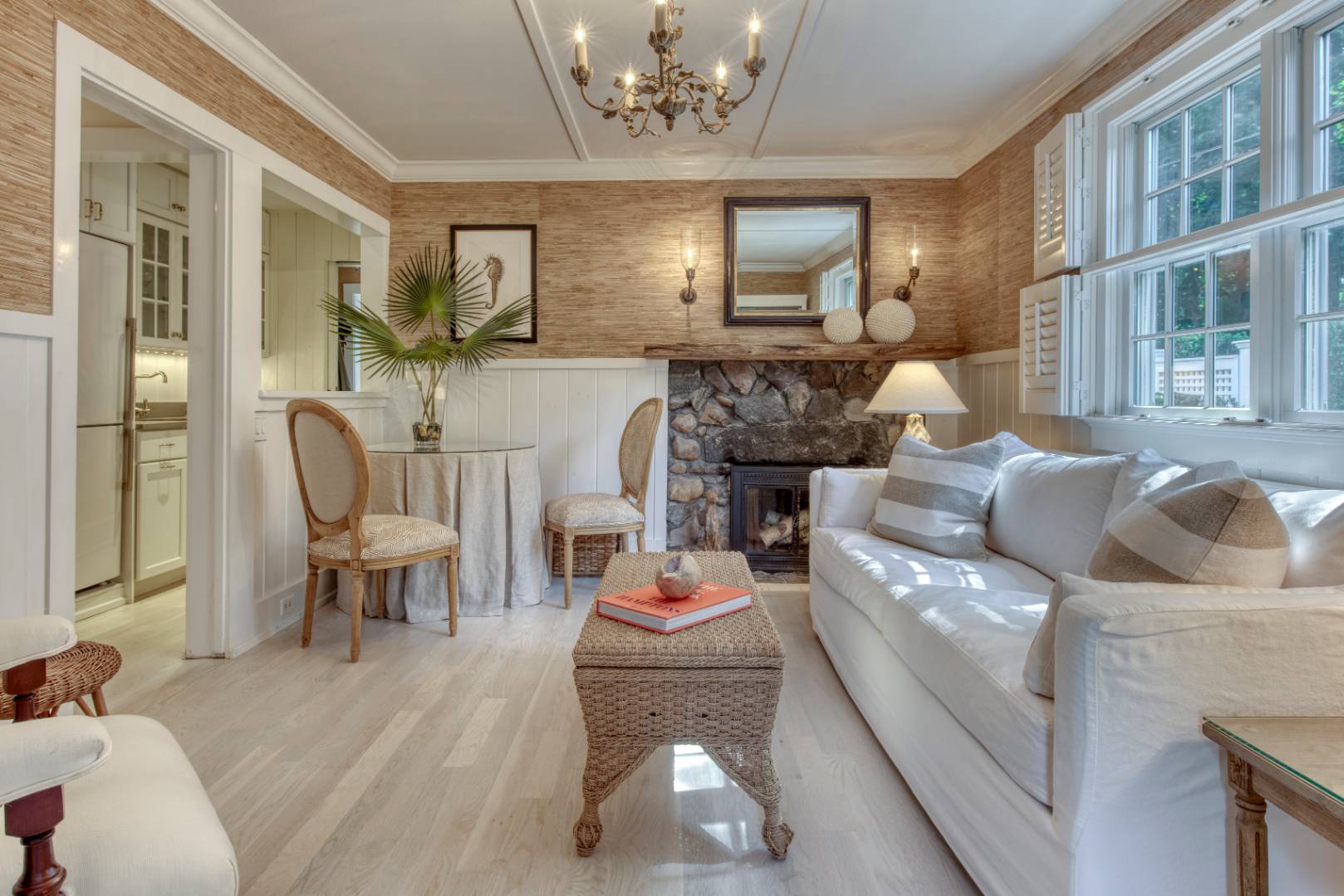 35 Harris Lane Southampton, NY 11968 - Photo 17 of 17 a living room with furniture and a chandelier