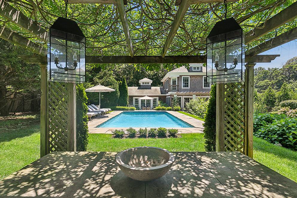 35 Harris Lane Southampton, NY 11968 - Photo 3 of 17 a view of a small house with a yard potted plants