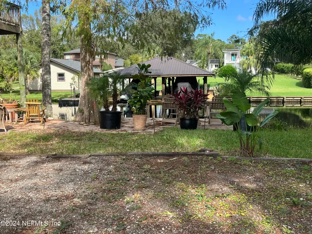 a view of a chairs and tables in the patio