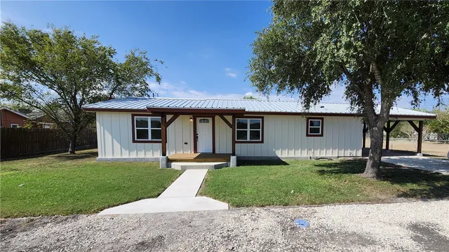 front view of a house with a yard