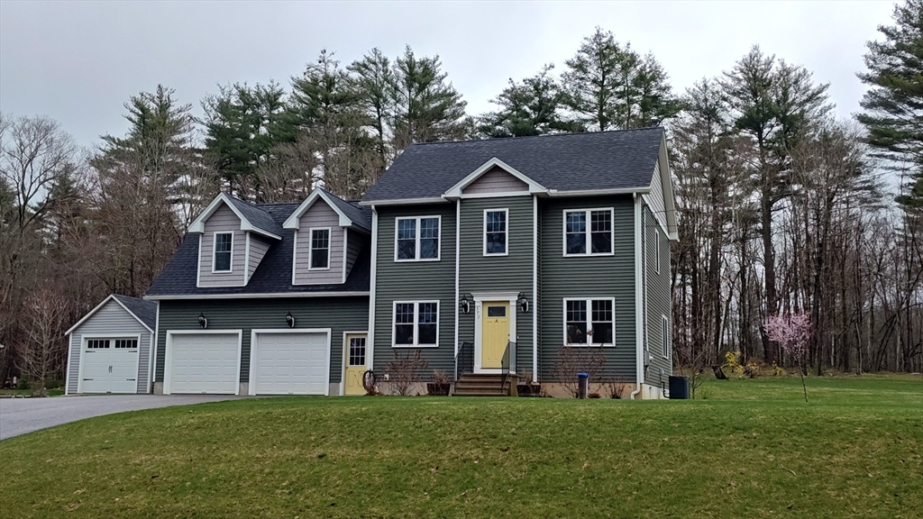 577 Podunk Road East Brookfield, MA 01515 - Photo 1 of 42 a front view of a house with a yard