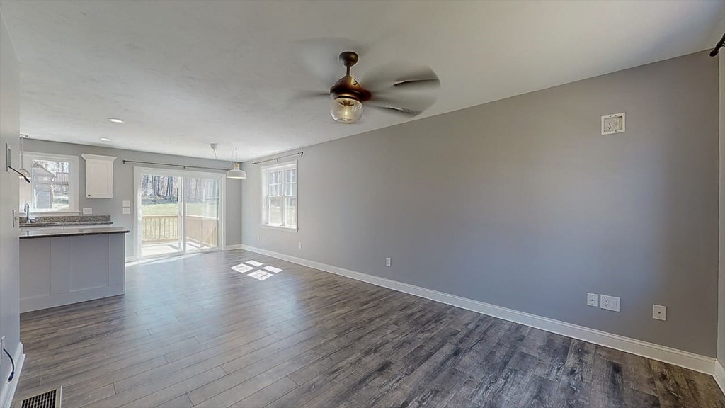 577 Podunk Road East Brookfield, MA 01515 - Photo 11 of 42 a view of an empty room with wooden floor and a window