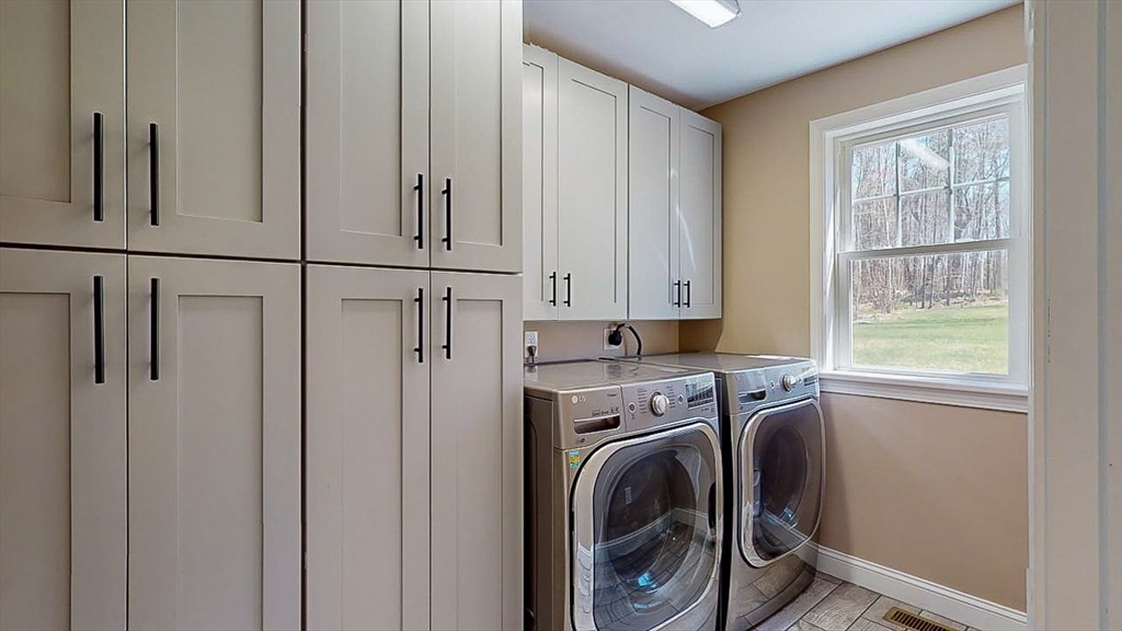 577 Podunk Road East Brookfield, MA 01515 - Photo 14 of 42 a view of a kitchen with washer and dryer