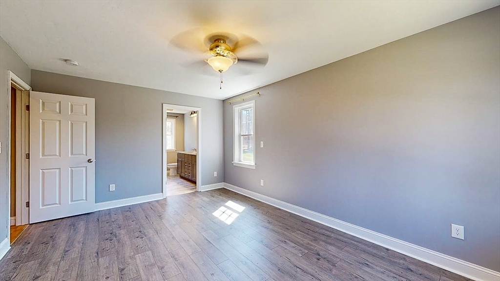 577 Podunk Road East Brookfield, MA 01515 - Photo 16 of 42 a view of an empty room with wooden floor