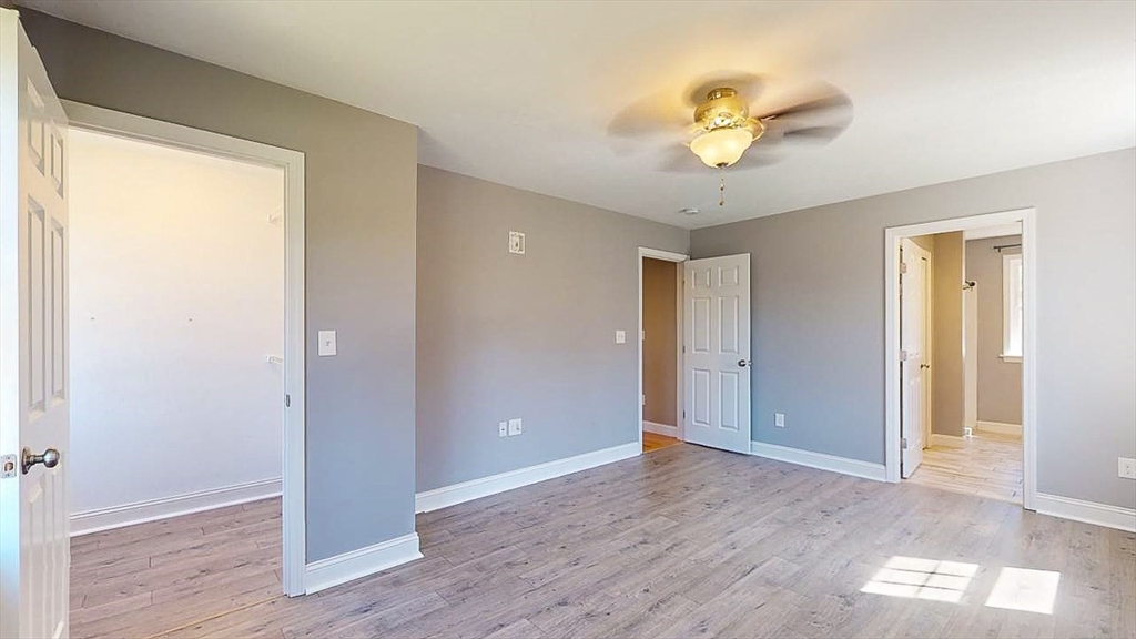 577 Podunk Road East Brookfield, MA 01515 - Photo 17 of 42 a view of a hallway with a window