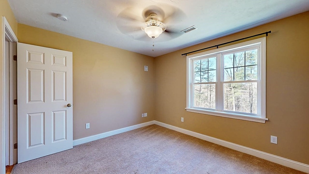 577 Podunk Road East Brookfield, MA 01515 - Photo 22 of 42 a view of an empty room with a window