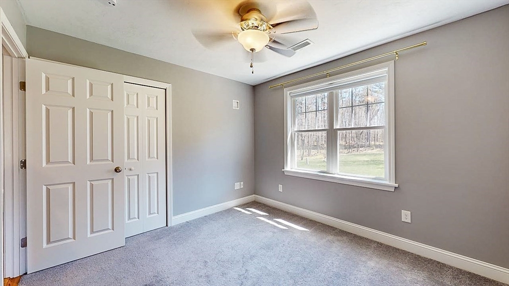 577 Podunk Road East Brookfield, MA 01515 - Photo 25 of 42 a view of an empty room with a window