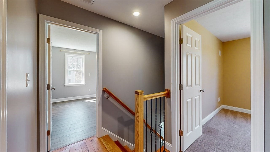 577 Podunk Road East Brookfield, MA 01515 - Photo 28 of 42 a view of a hallway with wooden floor and staircase