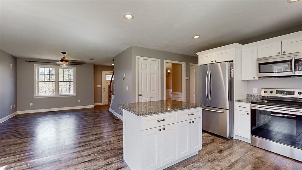 577 Podunk Road East Brookfield, MA 01515 - Photo 3 of 42 a kitchen with stainless steel appliances a refrigerator sink and microwave