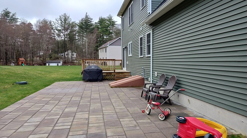 577 Podunk Road East Brookfield, MA 01515 - Photo 36 of 42 a backyard of a house with seating space