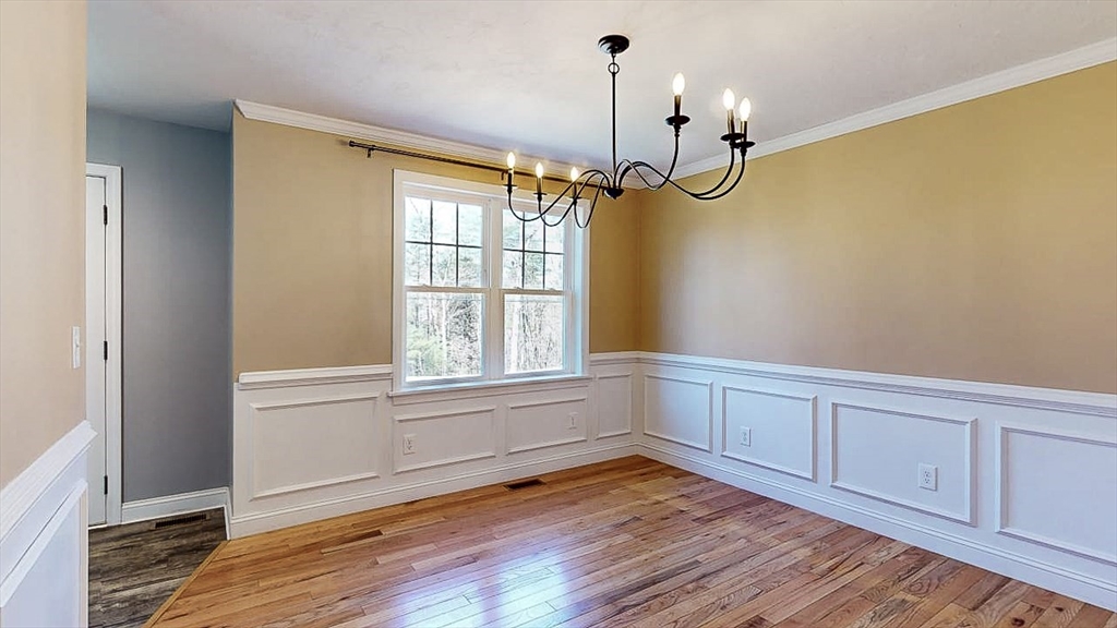 577 Podunk Road East Brookfield, MA 01515 - Photo 6 of 42 a view of empty room with wooden floor and fan