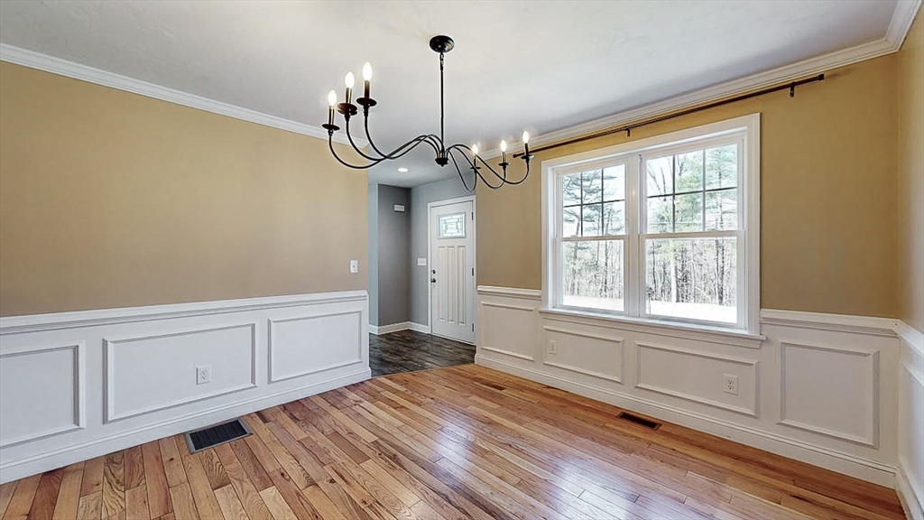 577 Podunk Road East Brookfield, MA 01515 - Photo 7 of 42 a view of empty room with wooden floor and fan