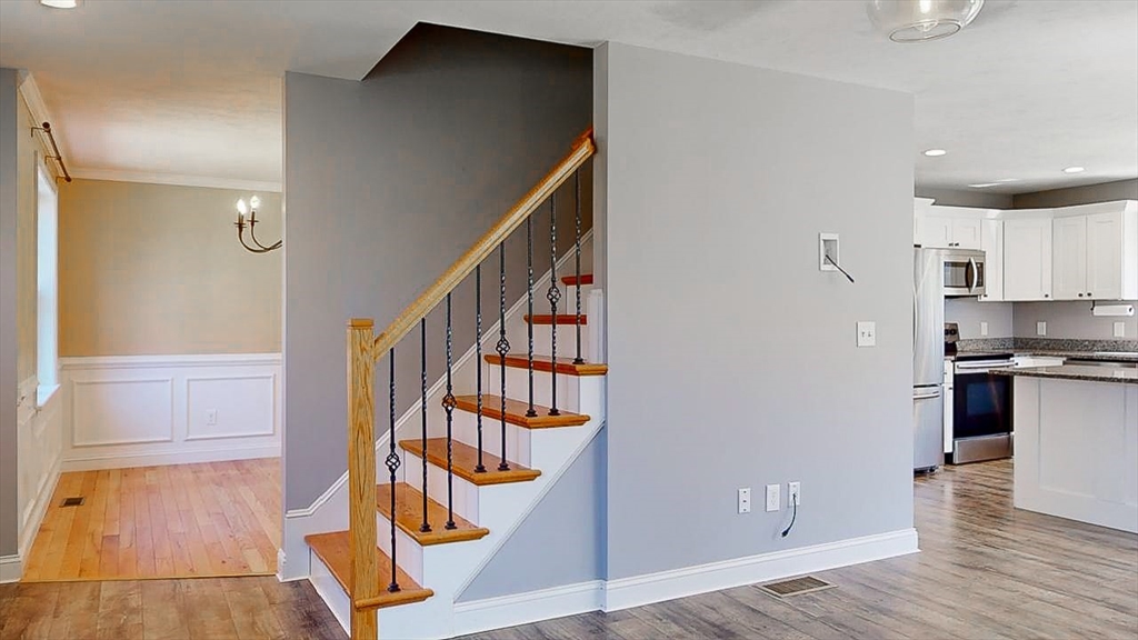 577 Podunk Road East Brookfield, MA 01515 - Photo 10 of 42 a view of front door with hallway and wooden floor