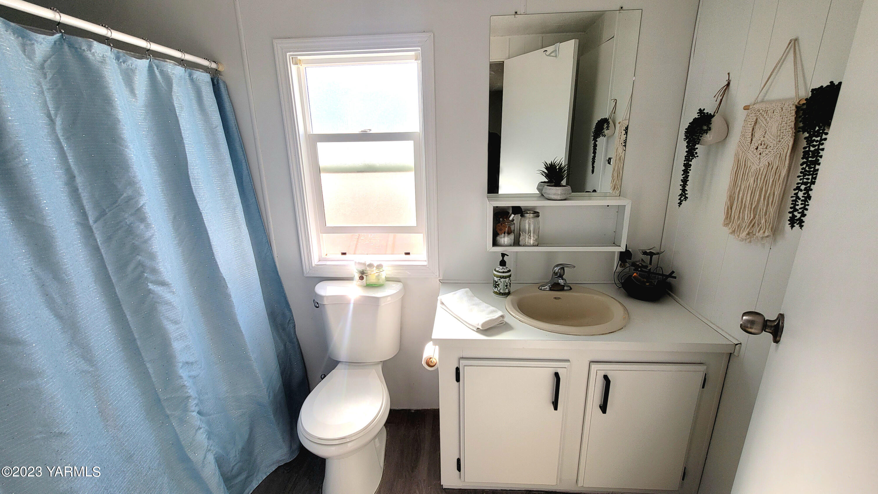 3005 Castlevale Road, Unit 26 Yakima, WA 98902 - Photo 7 of 12 a bathroom with a sink a toilet and a mirror