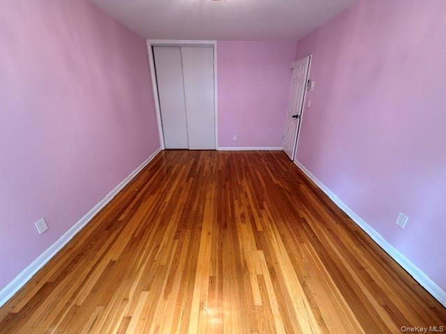 150-06 78th Road Queens, NY 11367 - Photo 10 of 22 a view of a room with wooden floor and staircase