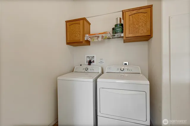 a kitchen with stainless steel appliances granite countertop a refrigerator and a stove