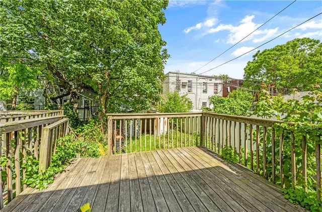 a view of balcony with wooden floor