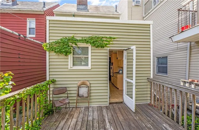 a view of a house with a yard and wooden floor