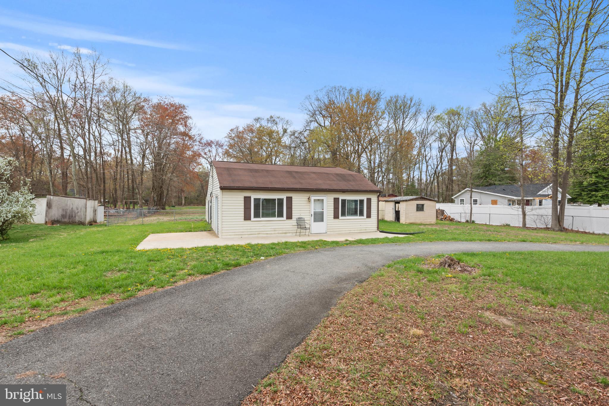1216 Pine Lane Accokeek, MD 20607 - Photo 1 of 1 a view of house with a big yard and large trees