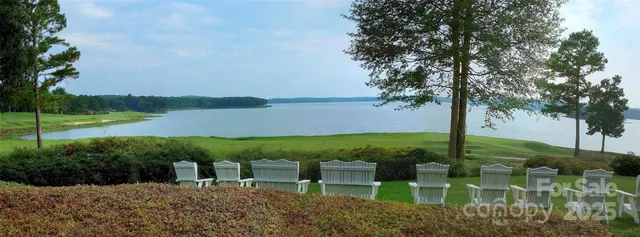 a view of a lake with a yard