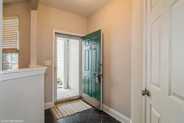 a view of a hallway with a window