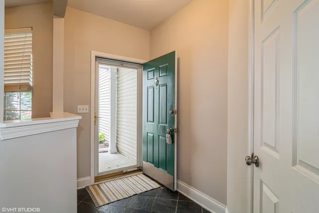 a view of a hallway with a window