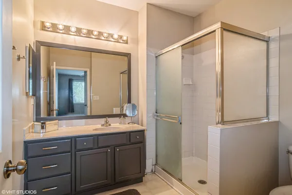 a bathroom with a double vanity sink mirror and double