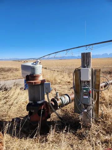 a view of a ocean with furniture