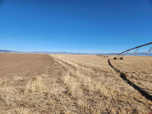 an aerial view of residential houses with ocean view