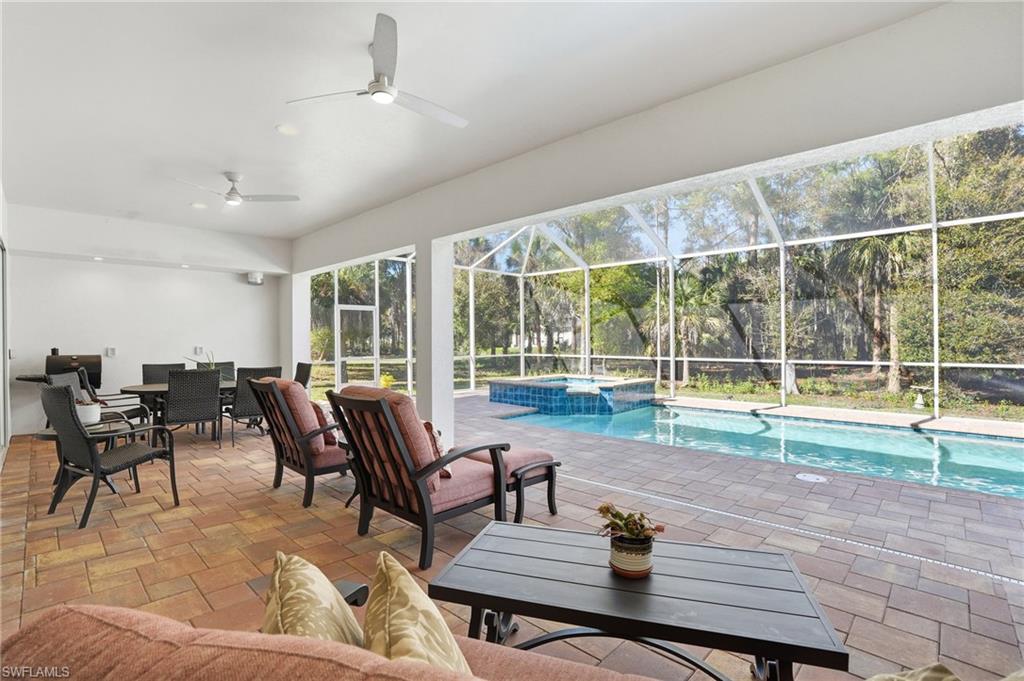 3707 5th Avenue Southwest Naples, FL 34117 - Photo 34 of 45 Relax on under your long covered lanai and extended pool deck