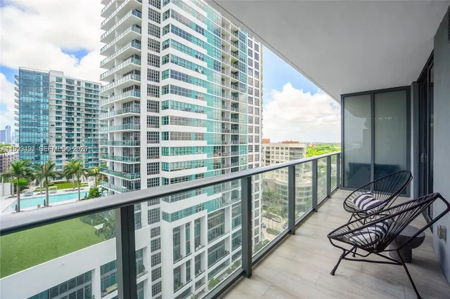 a view of a balcony with chairs