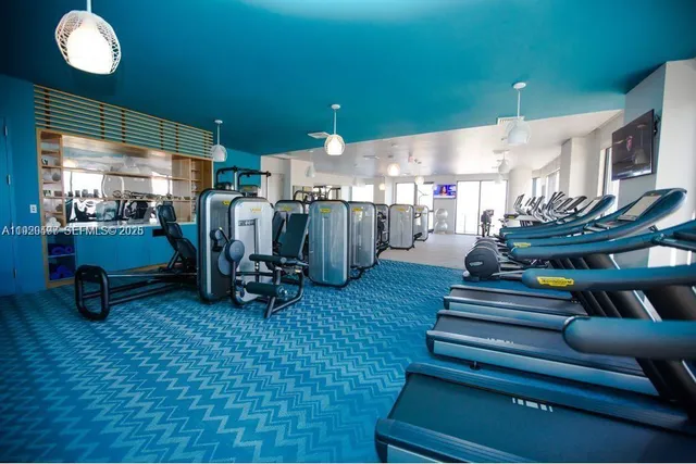 a room with lots of furniture and a chandelier