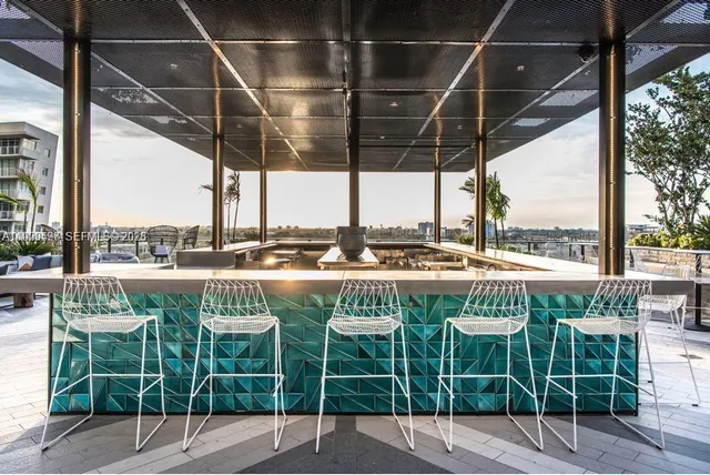 a patio with a table and chairs