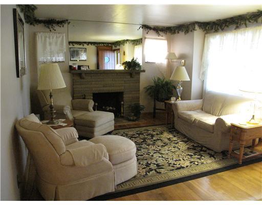 297 Coraopolis Road Coraopolis, PA 15108 - Photo 3 of 18 Living Room. Neutral living room with fireplace and wood floors.